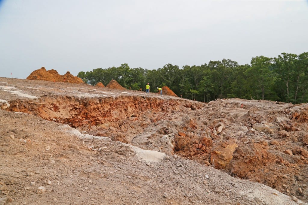 Hillside area after the blasting was done on Thursday August 23rd. The mound of rock and soil is the material moved down the hill by the blast. (08/23/18)
